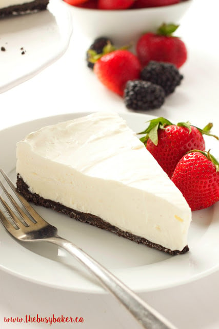 This Classic No Bake Cheesecake is so creamy and delicious and it's made with only 3 ingredients!! It's the perfect easy dessert that you don't have to bake! Serve it with fresh berries for an easy summer treat or add whatever toppings you like and enjoy it any time of the year! Recipe from thebusybaker.ca! #summerdessert #bestevernobakecheesecake