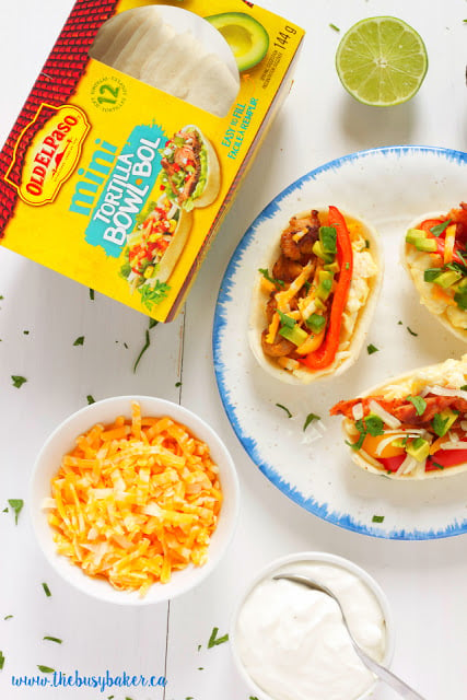 overhead image of a plate full of hand held mini burrito bowls next to a package of Old El Paso brand burrito bowls