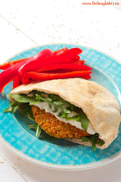 meatless quinoa burger on a plate with red bell pepper strips