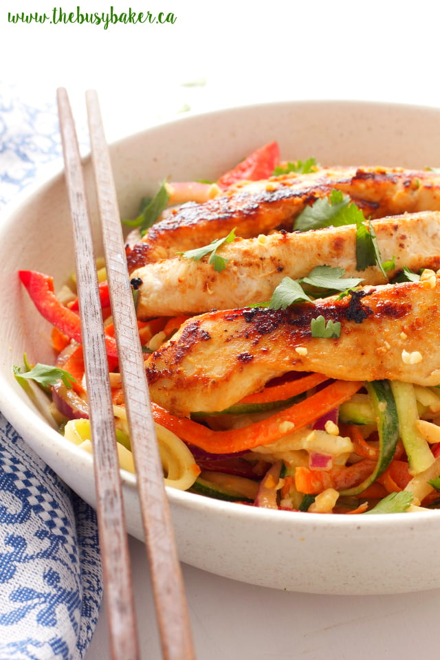 This Thai Chicken Spiralized Zucchini Salad is a healthy Asian-inspired meal featuring grilled chicken breast, spiralized veggies, and an easy peanut sauce! Recipe from www.thebusybaker.ca