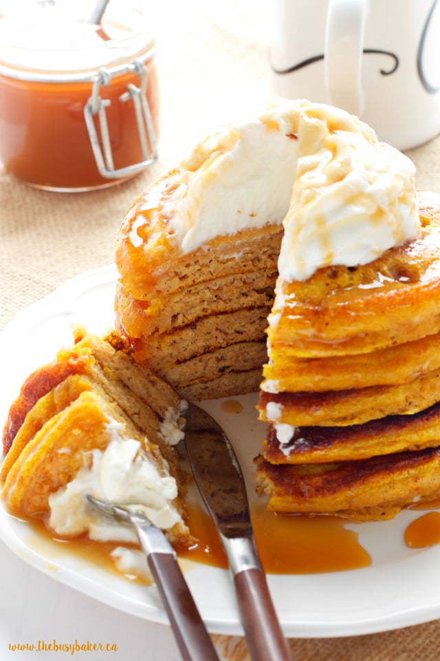 close up image: to a slice of pancakes on a fork 