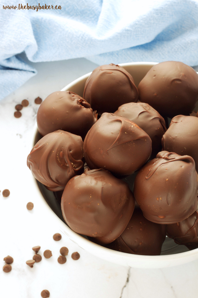 These No Bake Chocolate Dipped Cookie Dough Balls are the perfect sweet treat recipe! www.thebusybaker.ca