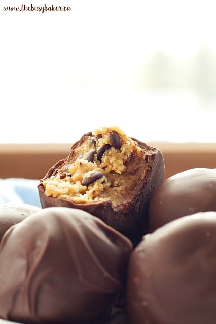 These No Bake Chocolate Dipped Cookie Dough Balls are the perfect sweet treat recipe! www.thebusybaker.ca