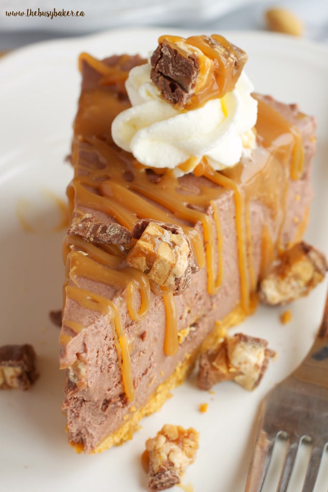 slice of cheesecake with caramel and snickers