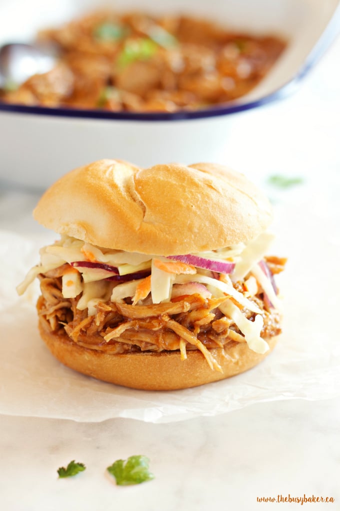 These Easy Slow Cooker Barbecue Pulled Pork Sandwiches feature a super easy 3-ingredient Slow Cooker Pulled Pork with an easy homemade coleslaw! Recipe from thebusybaker.ca!