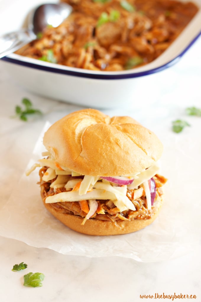 These Easy Slow Cooker Barbecue Pulled Pork Sandwiches feature a super easy 3-ingredient Slow Cooker Pulled Pork with an easy homemade coleslaw! Recipe from thebusybaker.ca!