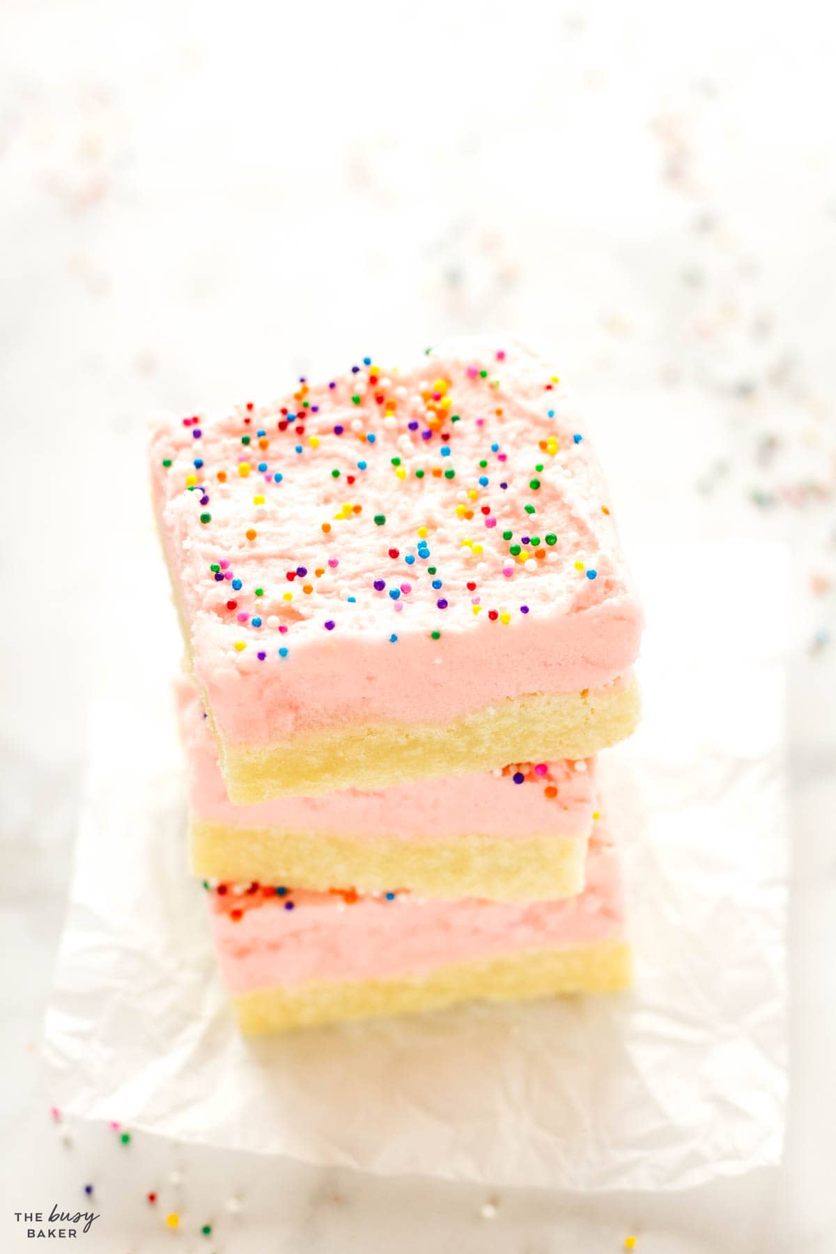 sweet treat recipe with pink frosting and sprinkles
