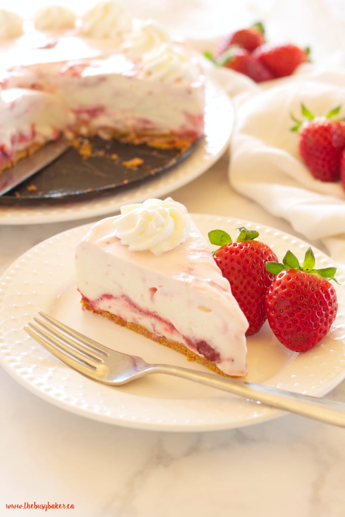 This Easy No Bake Strawberry Swirl Cheesecake is a delicious, easy to make, creamy and smooth dessert for spring and summer! And it's gelatin-free! Recipe from thebusybaker.ca!