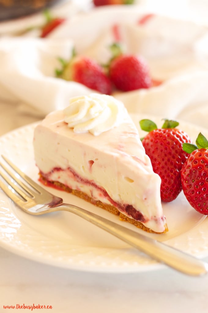 This Easy No Bake Strawberry Swirl Cheesecake is a delicious, easy to make, creamy and smooth dessert for spring and summer! And it's gelatin-free! Recipe from thebusybaker.ca!