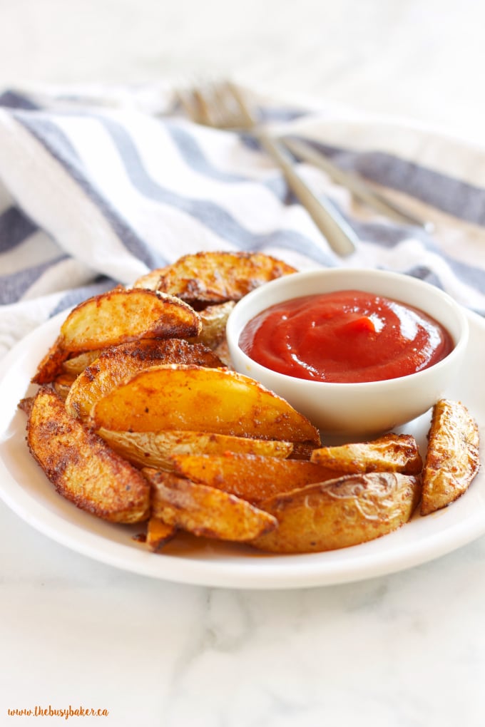 These Crispy Barbecue Potato Wedges are the perfect summer side dish - crispy on the outside and soft on the inside, with deliciously smoky BBQ flavor! Recipe from thebusybaker.ca!