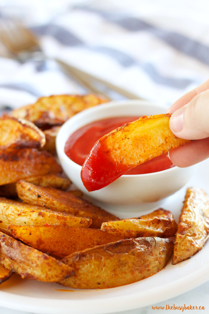 These Crispy Barbecue Potato Wedges are the perfect summer side dish - crispy on the outside and soft on the inside, with deliciously smoky BBQ flavor! Recipe from thebusybaker.ca!
