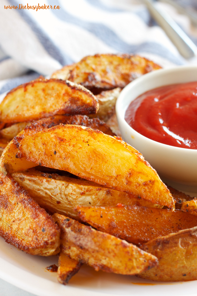 These Crispy Barbecue Potato Wedges are the perfect summer side dish - crispy on the outside and soft on the inside, with deliciously smoky BBQ flavor! Recipe from thebusybaker.ca!
