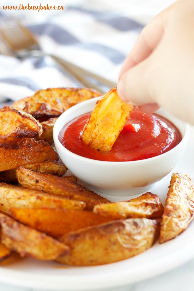 These Crispy Barbecue Potato Wedges are the perfect summer side dish - crispy on the outside and soft on the inside, with deliciously smoky BBQ flavor! Recipe from thebusybaker.ca!