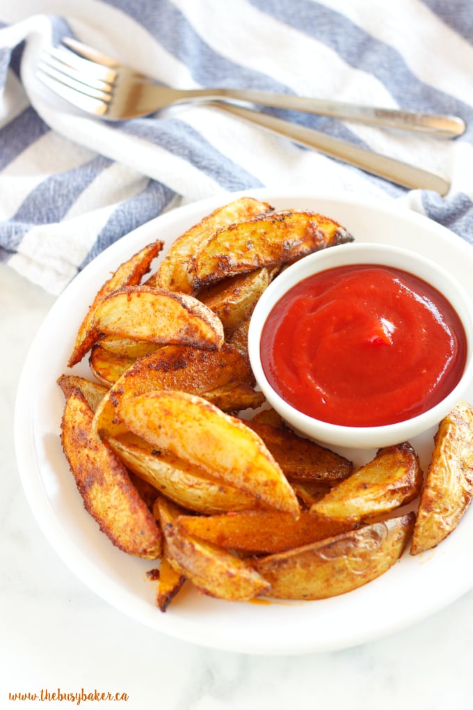 These Crispy Barbecue Potato Wedges are the perfect summer side dish - crispy on the outside and soft on the inside, with deliciously smoky BBQ flavor! Recipe from thebusybaker.ca!