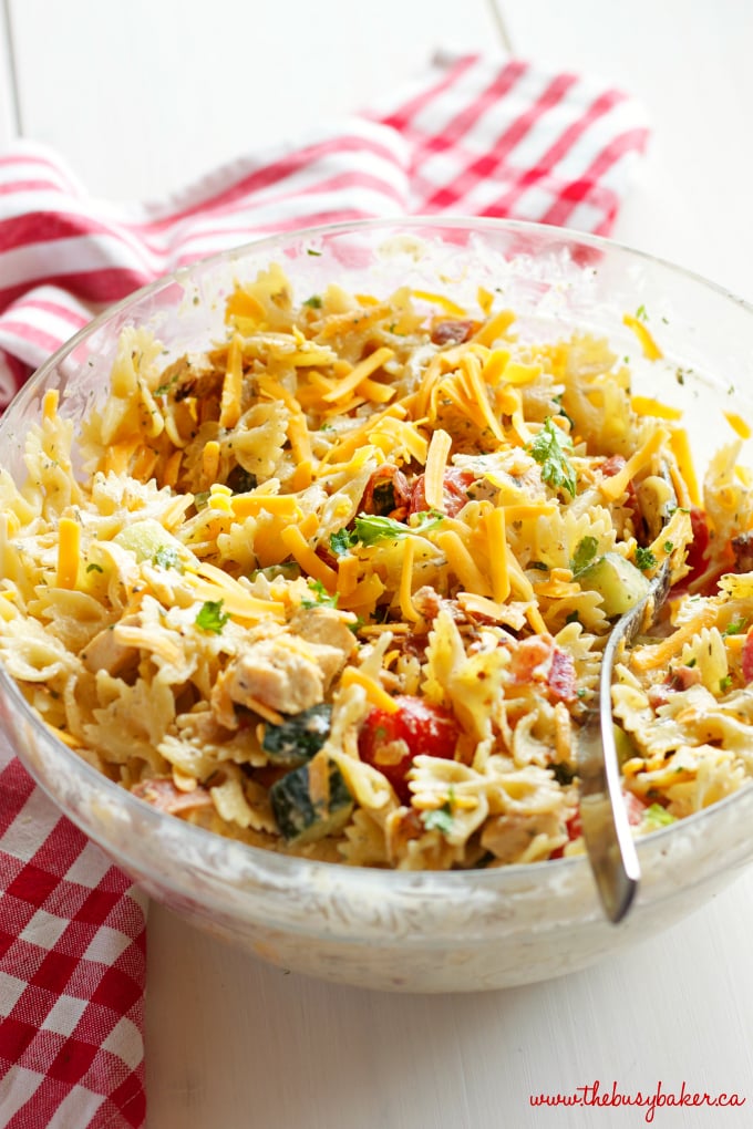This Chicken Bacon Ranch Pasta Salad is the perfect summer pasta salad featuring grilled chicken, crispy bacon, veggies and creamy ranch dressing! Recipe from thebusybaker.ca