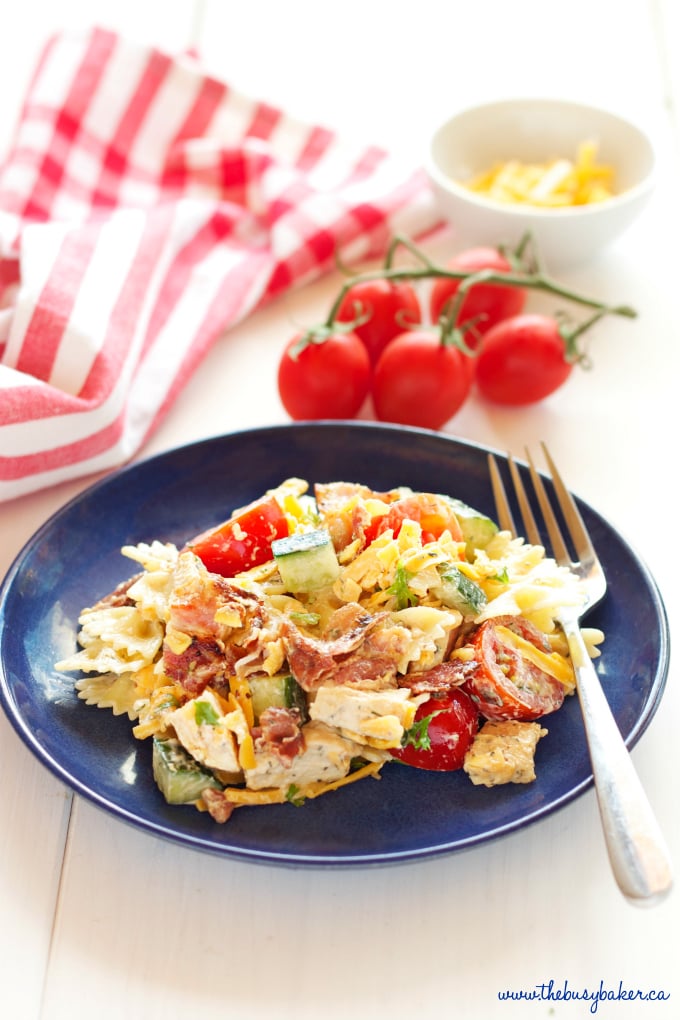 This Chicken Bacon Ranch Pasta Salad is the perfect summer pasta salad featuring grilled chicken, crispy bacon, veggies and creamy ranch dressing! Recipe from thebusybaker.ca