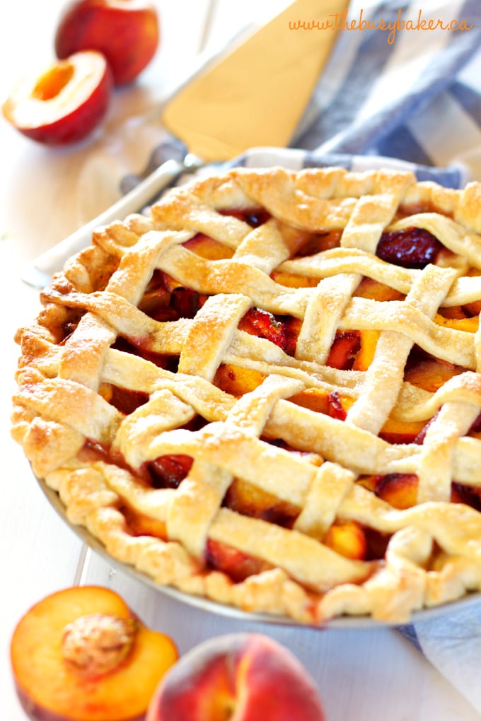 This Easy Classic Peach Pie recipe is simple and rustic, made with a butter crust and fresh peaches. Recipe includes my pro tips for the perfect pie every time! www.thebusybaker.ca