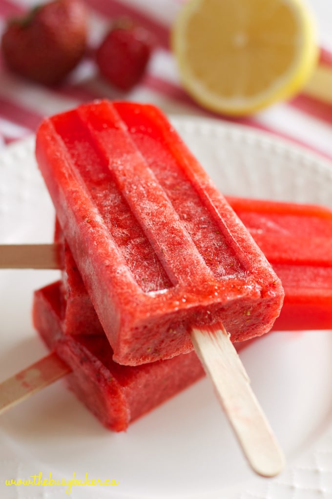 These Strawberry Lemonade Popsicles are the perfect healthy easy to make summer treat that's made with fresh strawberries and lemons! Perfect for kids! Recipe from thebusybaker.ca