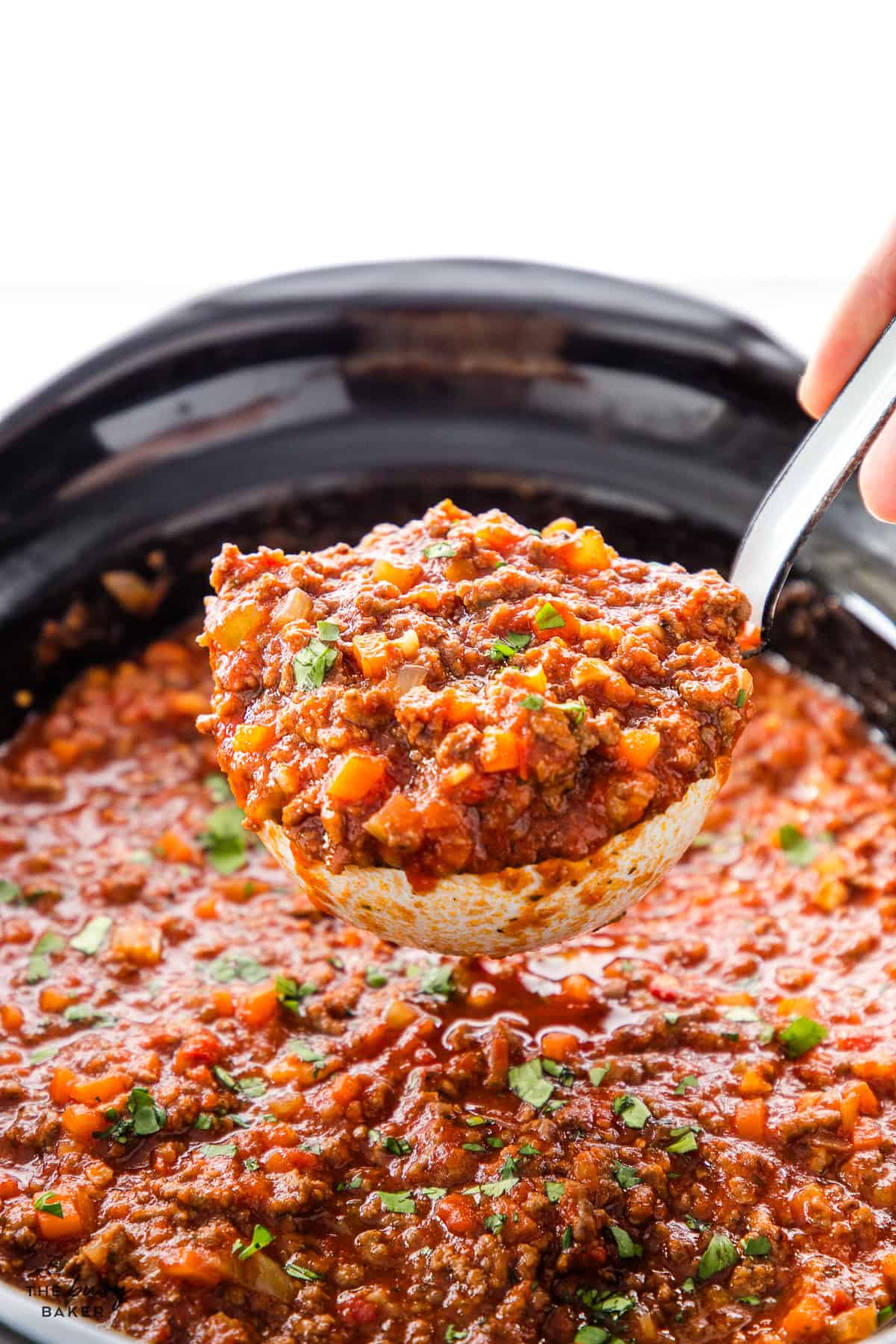 a big spoon full of slow cooker spaghetti sauce