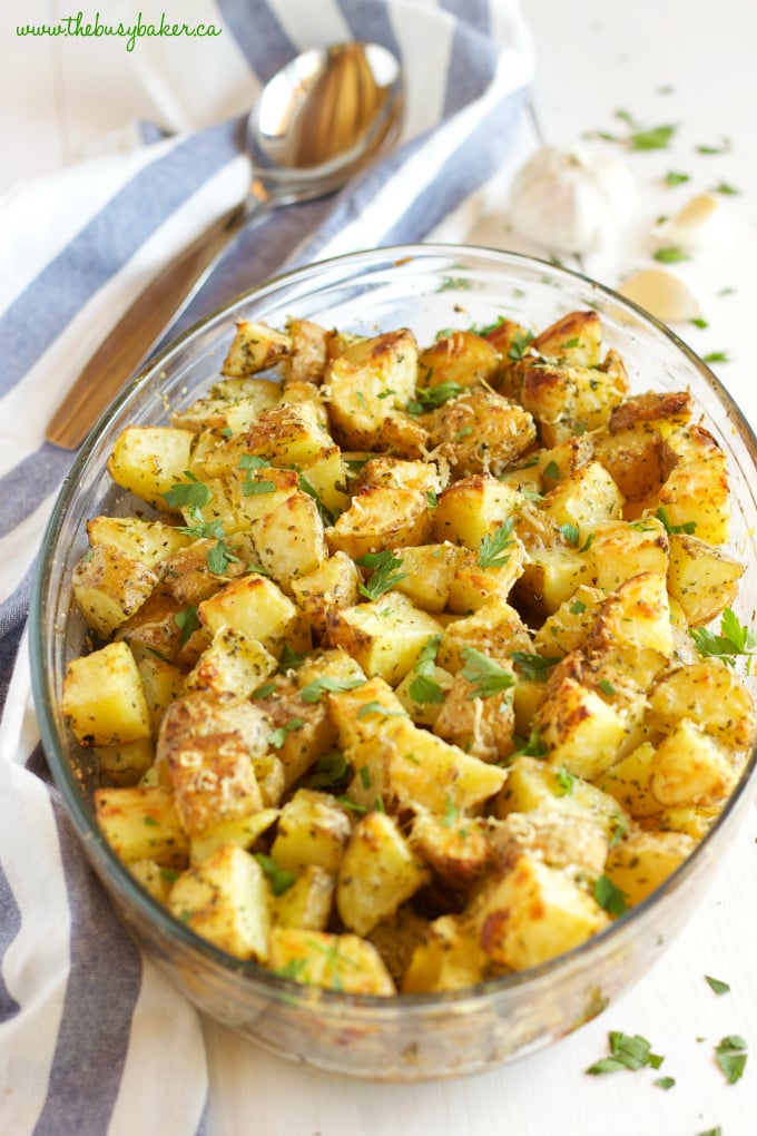 These Garlic Parmesan Oven Roasted Potatoes are an easy to make side dish made with only a few simple ingredients, perfect for the holidays or any time of year!! Recipe from thebusybaker.ca #holidaysidedish #holidayrecipe #thanksgiving #christmas