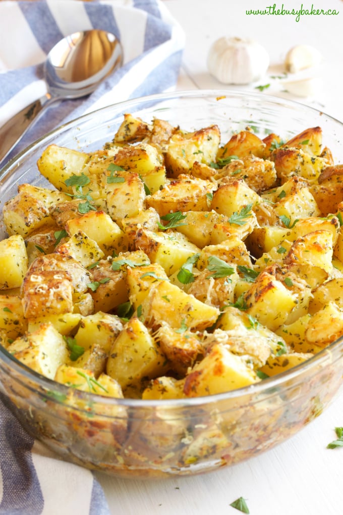 These Garlic Parmesan Oven Roasted Potatoes are an easy to make side dish made with only a few simple ingredients, perfect for the holidays or any time of year!! Recipe from thebusybaker.ca #holidaysidedish #holidayrecipe #thanksgiving #christmas