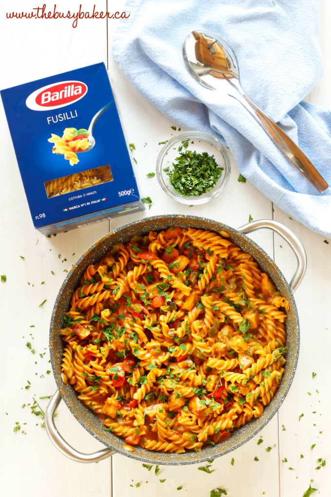 This Creamy One-Pot Chicken Enchilada Pasta is the perfect easy weeknight family meal made with simple ingredients in 30 minutes or less! Recipe from thebusybaker.ca! #easyfamilymeal #familymeal #weeknightmeal #onepotpasta #enchiladapasta