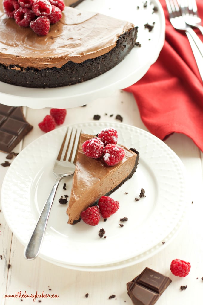 This No Bake Chocolate Mousse Cheesecake is the ultimate vegan and dairy-free chocolate dessert that's so smooth and creamy, made with a secret ingredient! Recipe from thebusybaker.ca #vegancheesecake #veganchocolatedessert #dairyfreedessert #dairyfreecheesecake #besteverchocolatecheesecake