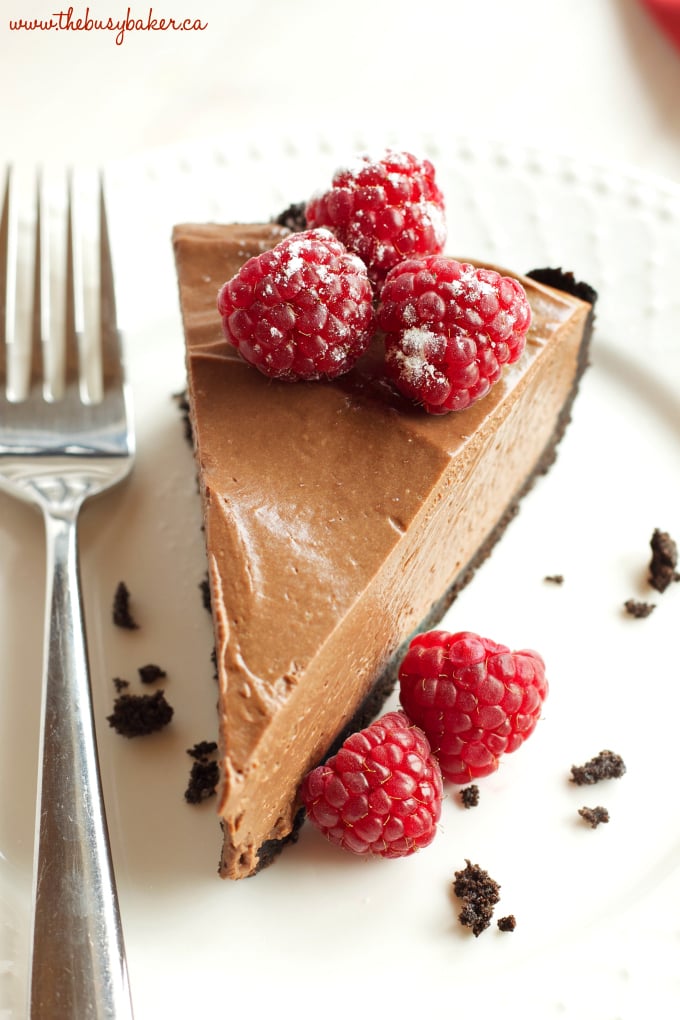 This No Bake Chocolate Mousse Cheesecake is the ultimate vegan and dairy-free chocolate dessert that's so smooth and creamy, made with a secret ingredient! Recipe from thebusybaker.ca #vegancheesecake #veganchocolatedessert #dairyfreedessert #dairyfreecheesecake #besteverchocolatecheesecake