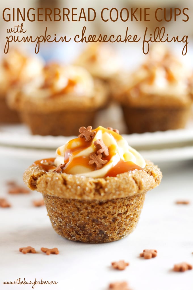 These Gingerbread Cookie Cups with Pumpkin Cheesecake Filling the perfect holiday dessert made with soft gingerbread, pumpkin cheesecake and caramel! Recipe from thebusybaker.ca! #caramelcookies #gingerbreadcookies #christmascookies #gingerbreadpumpkincookies