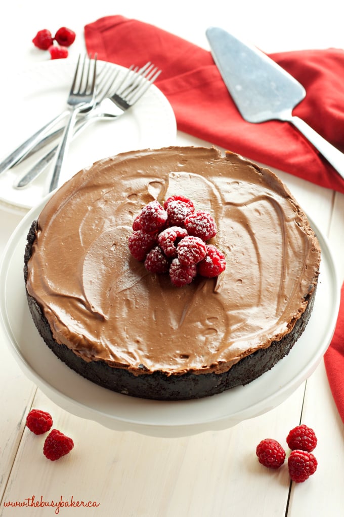 This No Bake Chocolate Mousse Cheesecake is the ultimate vegan and dairy-free chocolate dessert that's so smooth and creamy, made with a secret ingredient! Recipe from thebusybaker.ca #vegancheesecake #veganchocolatedessert #dairyfreedessert #dairyfreecheesecake #besteverchocolatecheesecake