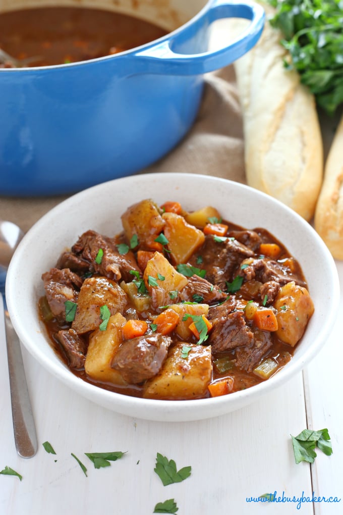 white bowl with beef stew made with beef, potatoes and vegetables