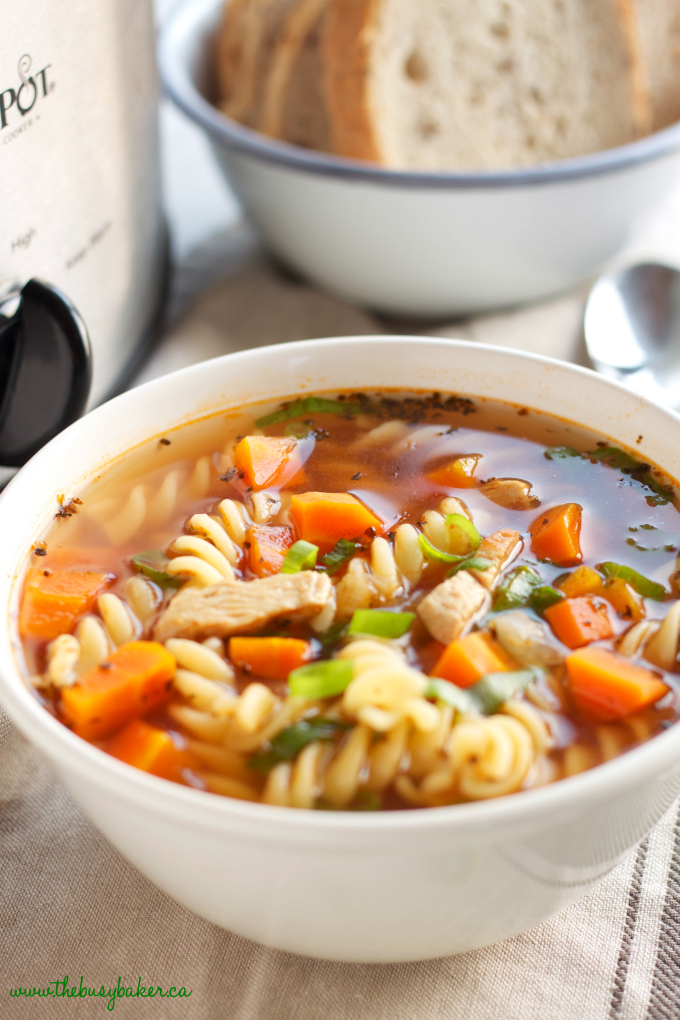 This Best Ever Slow Cooker Chicken Noodle Soup is healthy, wholesome, packed with veggies and lean chicken, and it's so easy to make in the Crock Pot or slow cooker!! It's the perfect soup for sick days and snow days! Recipe from thebusybaker.ca! #chickensoup #healthysoup #slowcookersoup #crockpotsoup #chickennoodlesoup