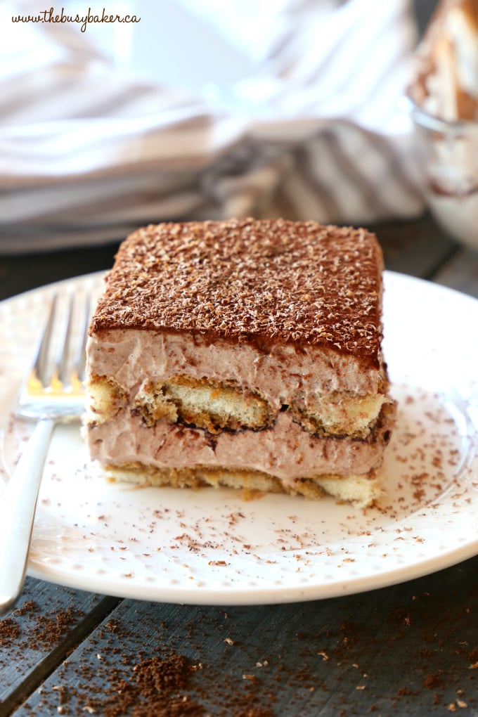 This Chocolate Mocha Tiramisu Icebox Cake is the perfect easy no bake dessert for coffee and chocolate lovers! Made with simple, basic ingredients and bursting with deep chocolate and coffee flavours, this is a no bake dessert that's a definite crowd pleaser! Recipe from thebusybaker.ca! #easytiramisurecipe #chocolatetiramisu #nobaketiramisu #nobakecoffeedessert