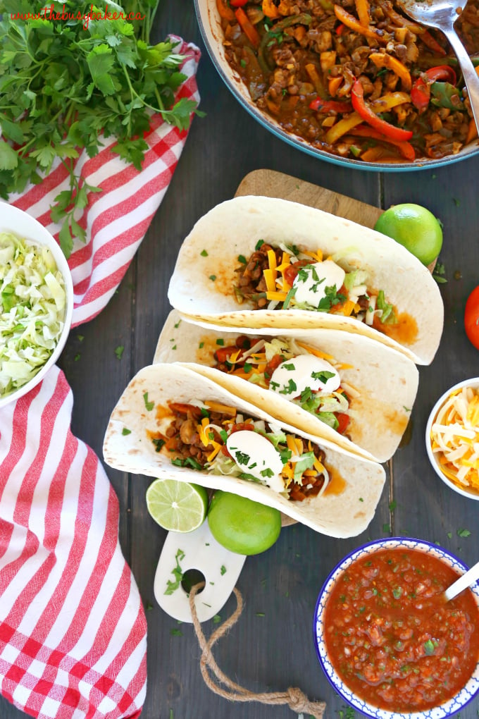 These Meal Prep Vegetarian Tacos are the perfect healthy meal prep solution for busy weeks! Make this delicious, family friendly veggie packed lentil taco filling and serve it in soft tacos, over salad, in lettuce wraps, and even for breakfast! Recipe from thebusybaker.ca! #LoveLentils #getPrepped #vegetariantacos #easyvegetarianrecipe