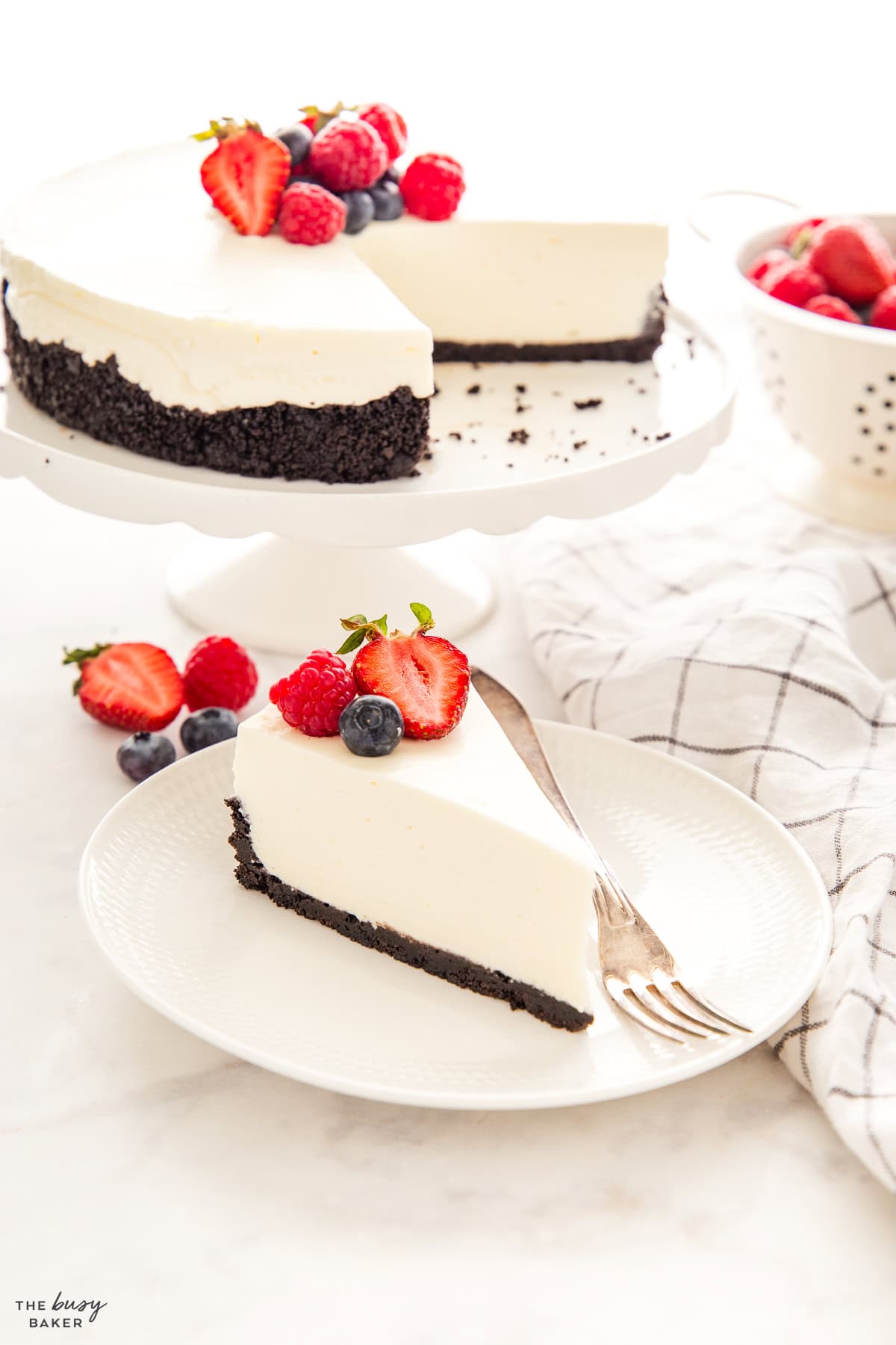 slice of no bake cheesecake on a plate with a fork