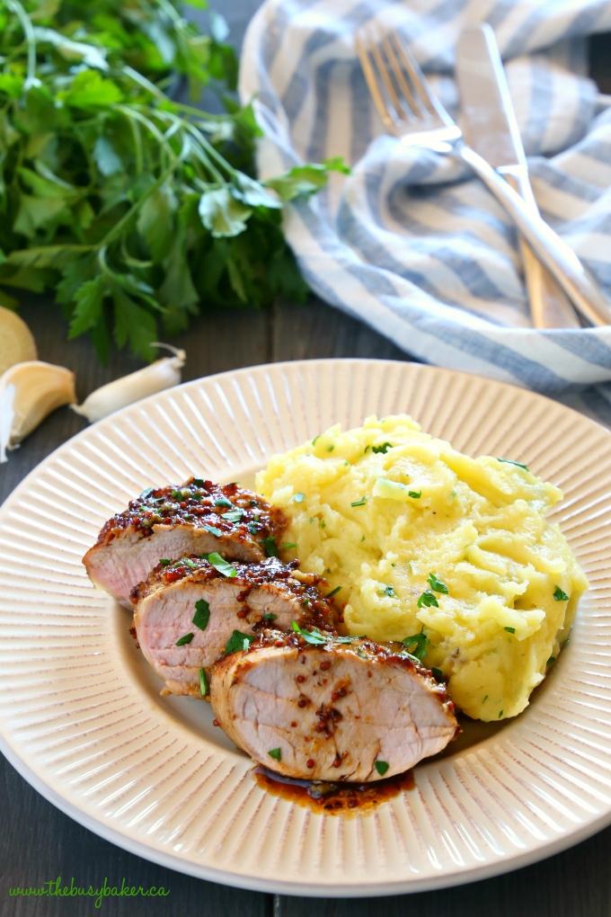 This Easy One Pan Sweet Ginger Glazed Pork Tenderloin is perfectly tender and juicy, cooked to perfection with a sweet ginger glaze! Made from basic ingredients you probably already have in your kitchen, this will quickly become one of your favourite ways to enjoy pork! Recipe from thebusybaker.ca! #easyporktenderloin #asianpork #gingerglazedpork