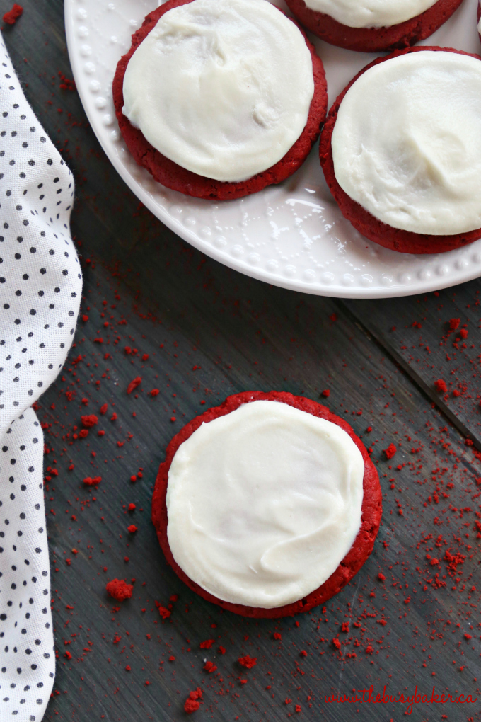 These Soft and Chewy Red Velvet Sugar Cookies are the perfect easy cookie recipe for Valentine's Day, Christmas, or any festive time of year. They're bright and colourful, gorgeous, delicious, and simple to make with only a few ingredients! Recipe from thebusybaker.ca! #cakemixcookies #redvelvetcookies #easyredvelvetrecipe #redvelvet