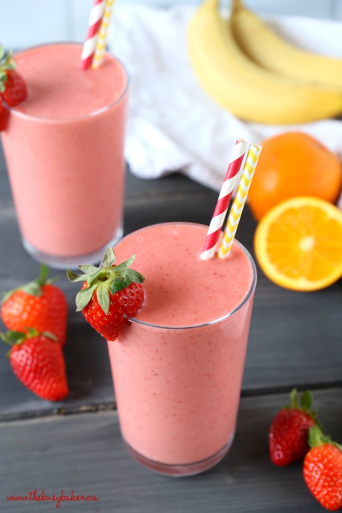 This Strawberry Banana Orange Power Smoothie is the perfect fruit smoothie packed with berries, bananas, and juicy oranges! It makes a great breakfast or post-workout drink, and it's the perfect mid-afternoon pick-me-up snack! Recipe from thebusybaker.ca! #workoutsmoothie #easysmoothie #healthysmoothie #strawberrysmoothie