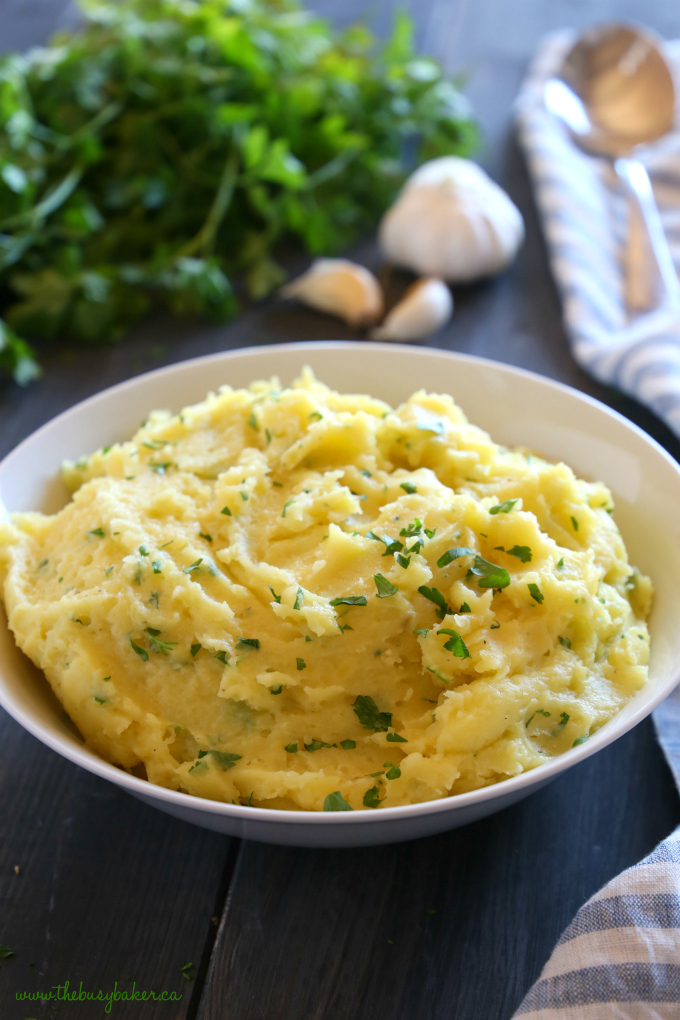 These Classic Dairy-Free Garlic Mashed Potatoes are vegan and dairy free, and they're the perfect traditional side dish for any family meal! Recipe from thebusybaker.ca! #holidaysidedish #dairyfreemashedpotatoes #vegansidedish