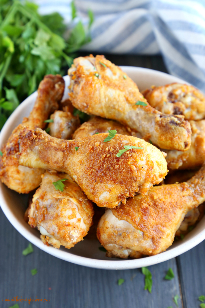 This Crispy Oven Fried Chicken is baked to crispy perfection in the oven with a delicious balance of herbs and spices! It's easy to make, lower in fat, and tastes just like fried chicken! And it's ready in under 30 minutes! Recipe from thebusybaker.ca! #ovenbakedchicken #crispychicken #healthychicken #ovenfriedchicken #copycatfriedchicken