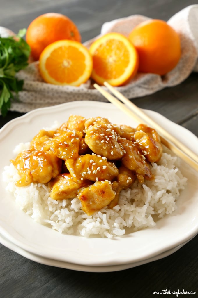 This Easy Healthier Sesame Orange Chicken is the perfect Asian-inspired weeknight meal that's better than take-out and a healthy choice for the whole family! Make it in 15 minutes or less! Recipe from thebusybaker.ca! #orangechicken #easystirfry #weeknightmeal #15minutemeal