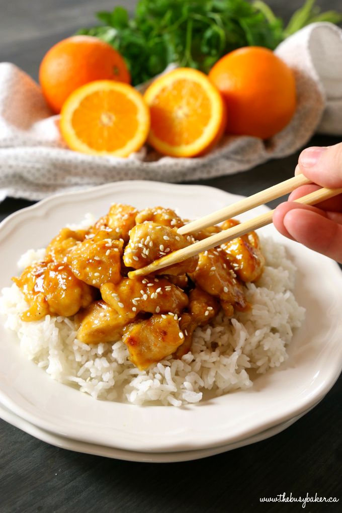 This Easy Healthier Sesame Orange Chicken is the perfect Asian-inspired weeknight meal that's better than take-out and a healthy choice for the whole family! Make it in 15 minutes or less! Recipe from thebusybaker.ca! #orangechicken #easystirfry #weeknightmeal #15minutemeal