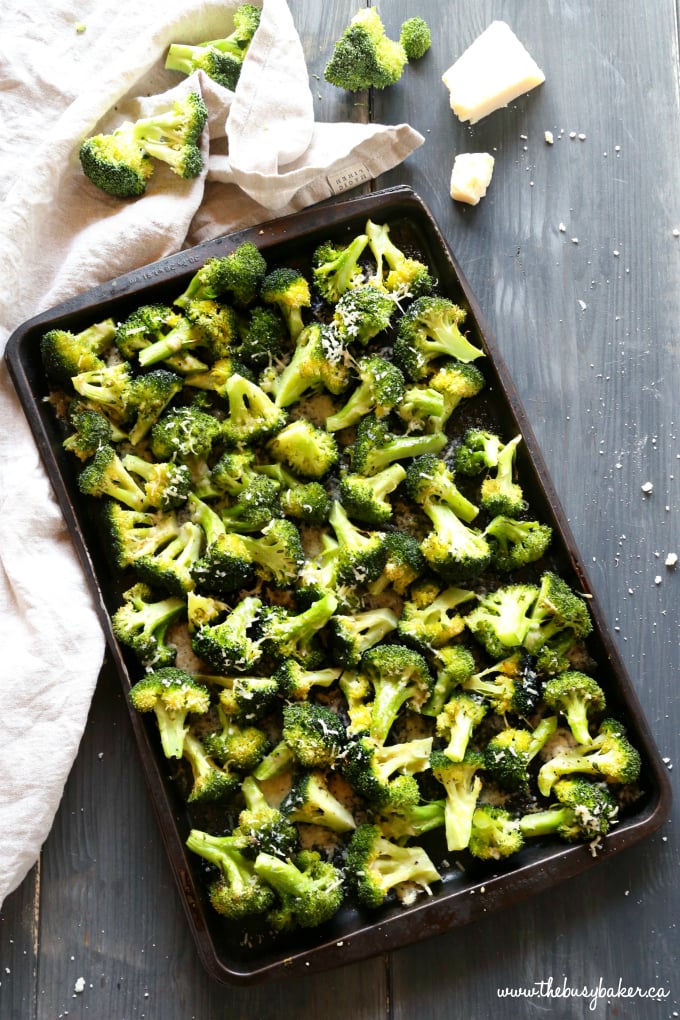 This Garlic Parmesan Roasted Broccoli is a quick and easy side dish that's healthy and delicious, and made with only 4 simple ingredients! It's a family favourite recipe that's the perfect holiday side dish, but it's delicious any time of the year! Recipe from thebusybaker.ca! #sidedish #roastedbroccoli #garlicparmesanbroccoli #easysidedishrecipe