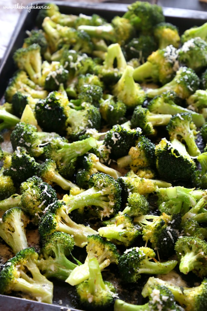 This Garlic Parmesan Roasted Broccoli is a quick and easy side dish that's healthy and delicious, and made with only 4 simple ingredients! It's a family favourite recipe that's the perfect holiday side dish, but it's delicious any time of the year! Recipe from thebusybaker.ca! #sidedish #roastedbroccoli #garlicparmesanbroccoli #easysidedishrecipe