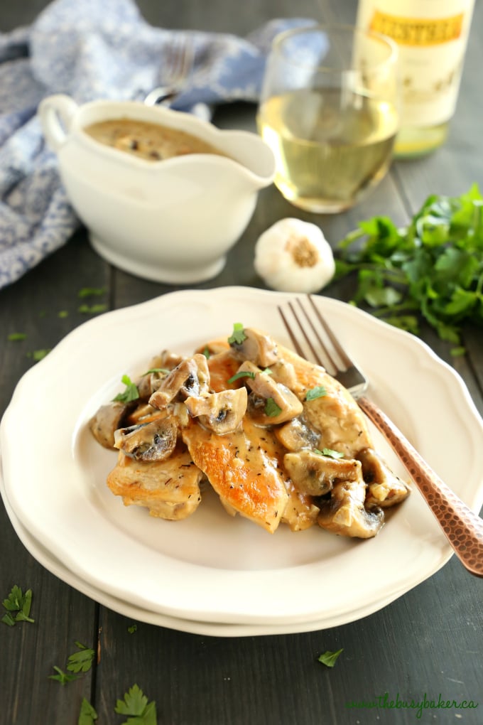 This One Pan Chicken with White Wine Mushroom Sauce is a super delicious restaurant-quality main dish that's so easy to make in only one pan! Recipe from thebusybaker.ca! #easychickenrecipe #chickenwhitewinemushroomsauce #whitewinesauce #easychickensauce 