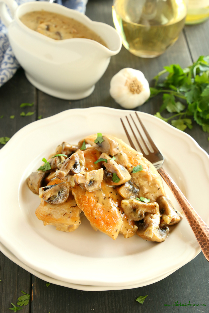 This One Pan Chicken with White Wine Mushroom Sauce is a super delicious restaurant-quality main dish that's so easy to make in only one pan! Recipe from thebusybaker.ca! #easychickenrecipe #chickenwhitewinemushroomsauce #whitewinesauce #easychickensauce 
