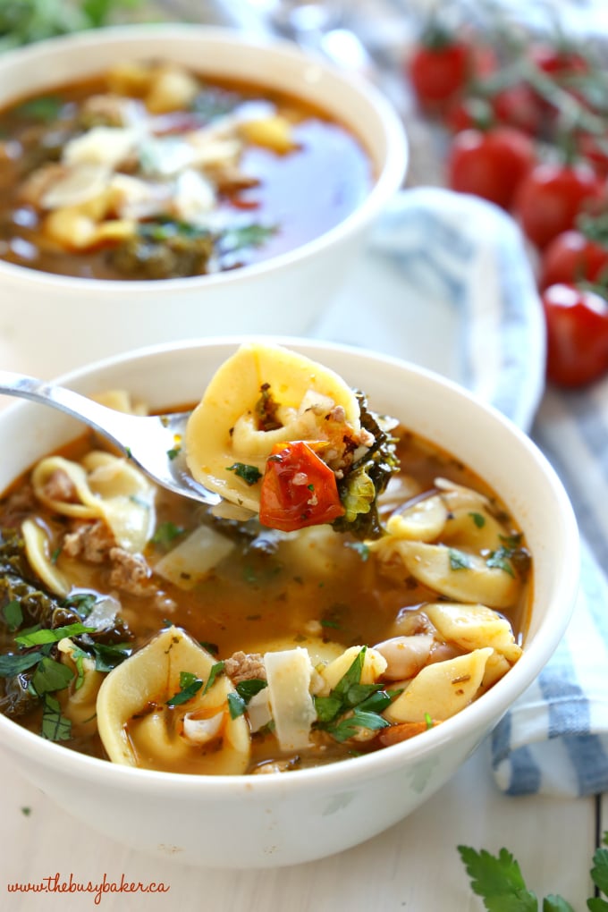 This Rustic Italian Sausage Tortellini Soup is packed with fresh, wholesome ingredients and bursting with Italian flavours. It's hearty, filling, and is so easy to make! Recipe from thebusybaker.ca! #italiansoup #tortellinisoup #rusticsoup #easysouprecipe