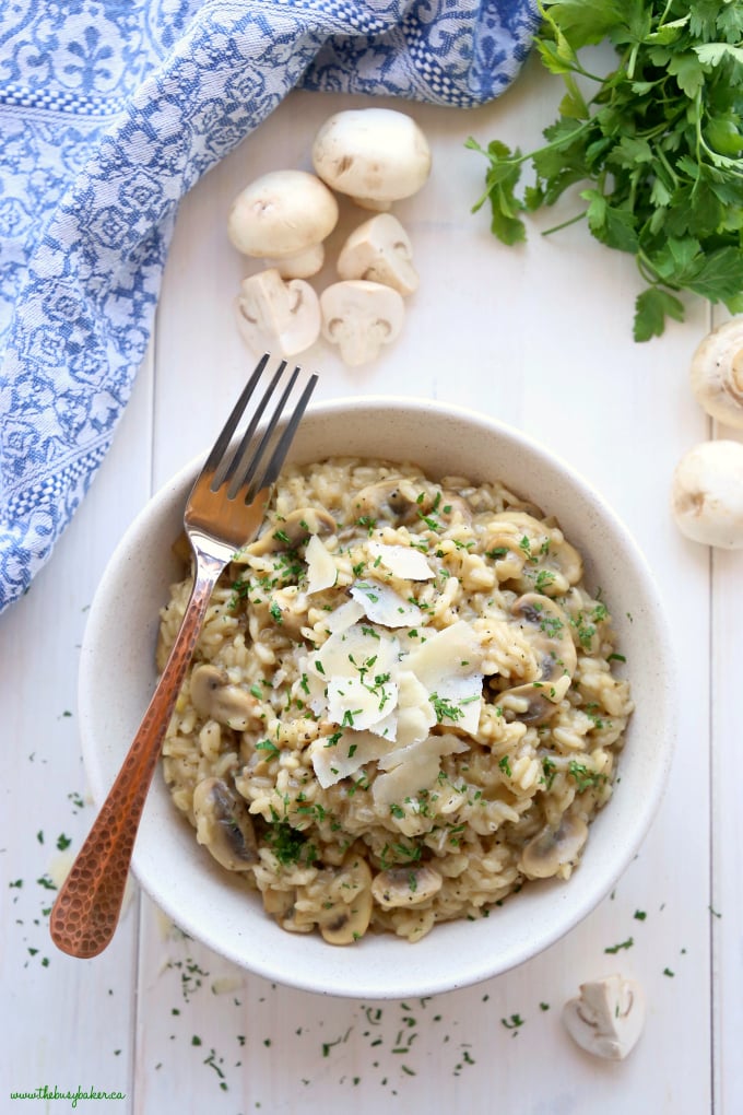 This Easy Mushroom Risotto is a quick and simple way to make restaurant-style risotto at home in minutes and in only one pan! Skip the fancy restaurant and enjoy it at home as a vegetarian main dish or side dish! Recipe from thebusybaker.ca! #easyrisotto #simplerisottorecipe #mushroomrisotto