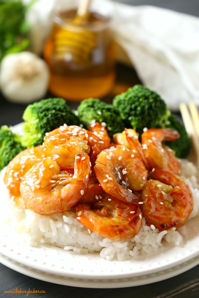 This Easy One Pan Honey Garlic Shrimp is a delicious Asian-inspired meal idea with the perfect honey garlic sauce. And it's made with simple ingredients in 15 minutes or less! Recipe from thebusybaker.ca! #easyhoneygarlicsauce #honeygarlicshrimp #15minutemeal