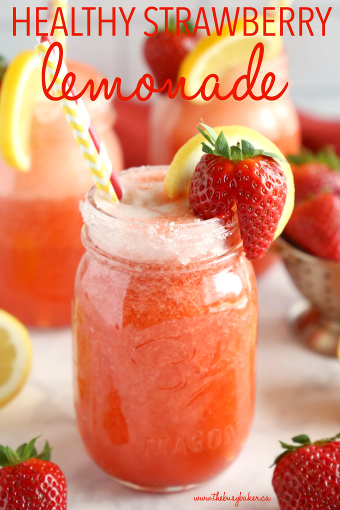 Healthy Strawberry Lemonade drink in mason jar with strawberries and lemons